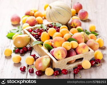 fresh various fruits in wooden box