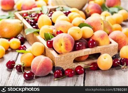 fresh various fruits in wooden box