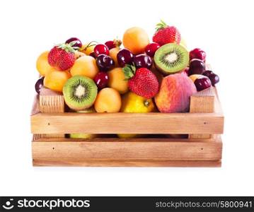 fresh various fruits in wooden box on white background
