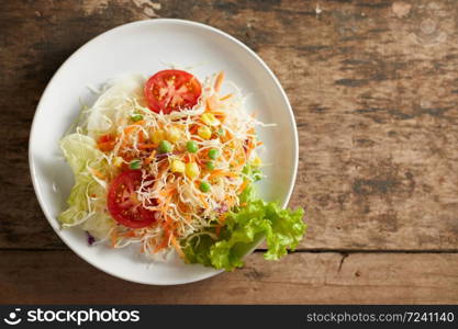 Fresh vegetable mixed salad on plate.