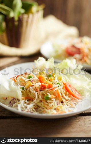 Fresh vegetable mixed salad on plate.  