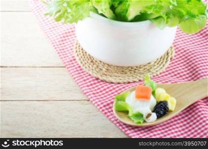 fresh vegetable salad in wooden spoon &#xA;
