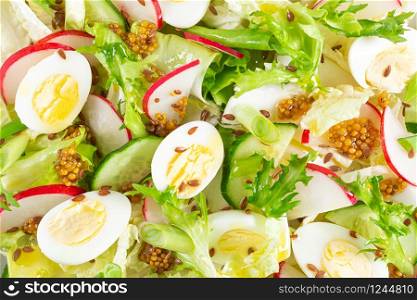 Fresh vegetable salad with cucumber, radish, lettuce and boiled eggs. Helathy food. Top view. Flat lay