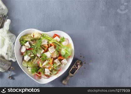 fresh vegetable salad with feta cheese and spice