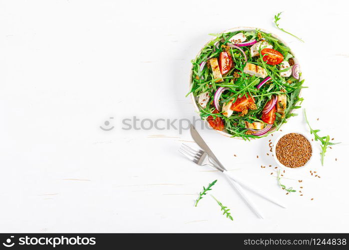 Fresh vegetable salad with grilled chicken fillet, breast, tomato and arugula, top view