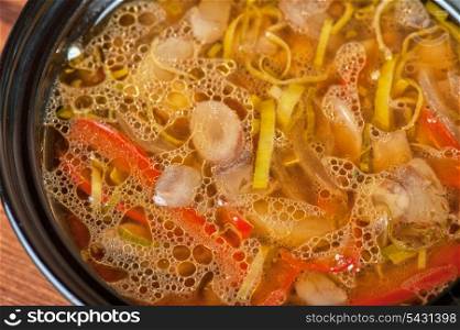Fresh vegetable soup made of mushrooms, pepper and onion