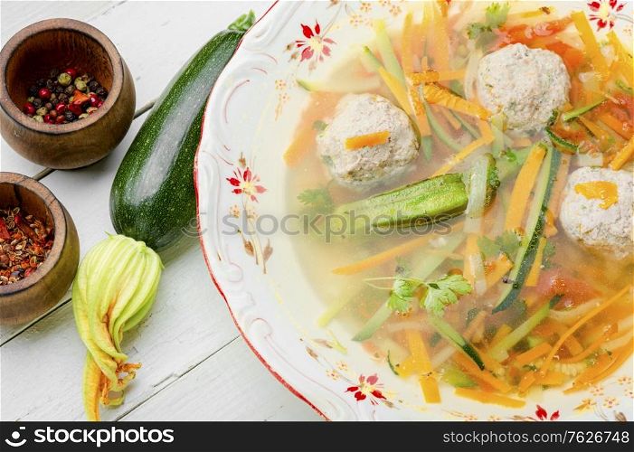 Fresh vegetable soup with meatballs and vegetables.Soup with zucchini.. Soup with meat balls and vegetables