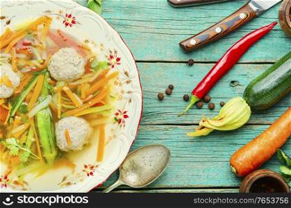 Fresh vegetable soup with meatballs and vegetables.Soup with zucchini.. Soup with meat balls and vegetables