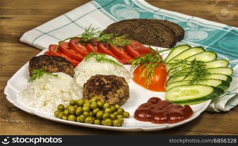 Fresh vegetables and boiled rice with meat ribs