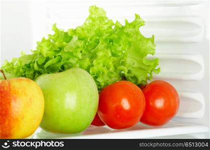Fresh vegetables and fruit in a refrigerator. Foodstuff