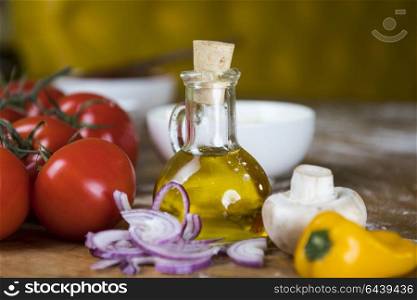 fresh vegetables and olive oil on the table