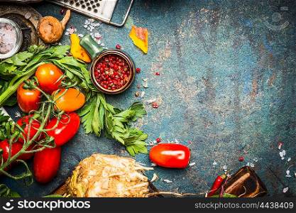 Fresh vegetables and spices ingredients for tasty vegetarian cooking on dark rustic background, top view
