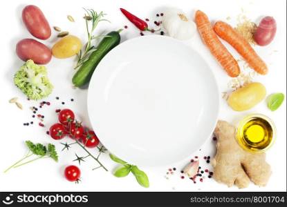 Fresh vegetables around empty white plate, top view, copy space
