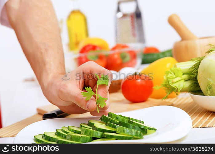 Fresh vegetables being cut with a knife