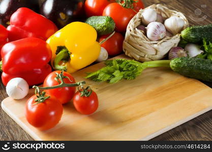 Fresh vegetables. Close up of various vegetables on wooden cutting board