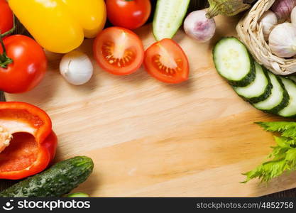 Fresh vegetables. Close up of various vegetables on wooden cutting board