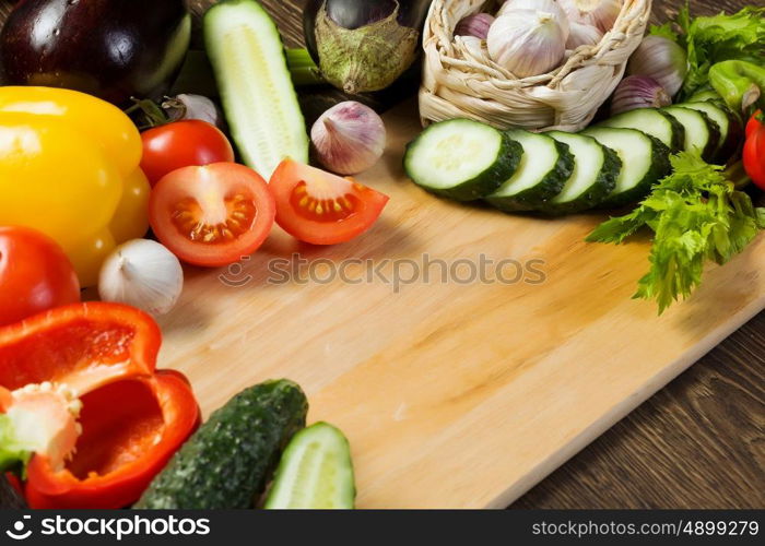 Fresh vegetables. Close up of various vegetables on wooden cutting board