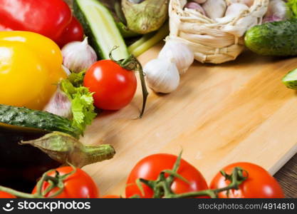 Fresh vegetables. Close up of various vegetables on wooden cutting board