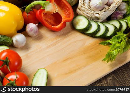 Fresh vegetables. Close up of various vegetables on wooden cutting board