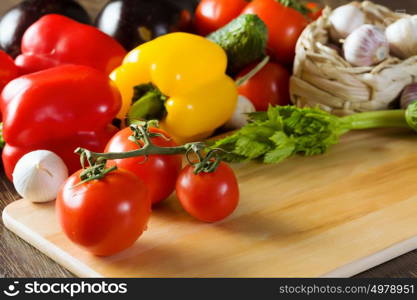 Fresh vegetables. Close up of various vegetables on wooden cutting board