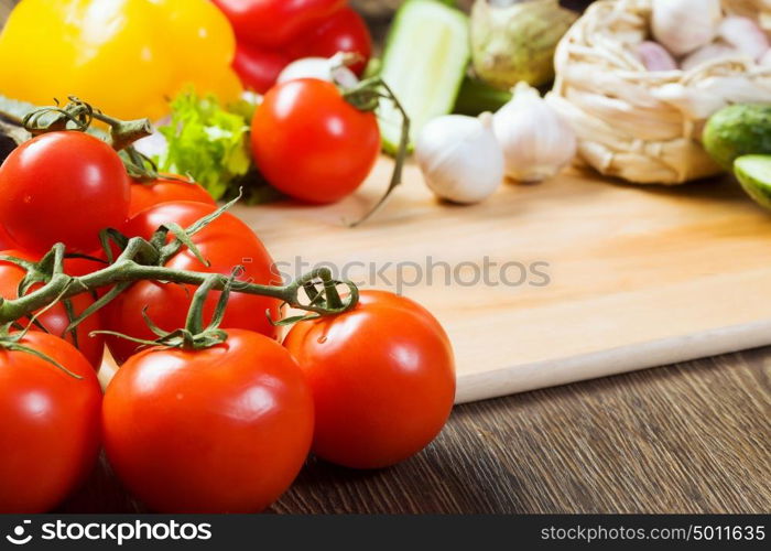 Fresh vegetables. Close up of various vegetables on wooden cutting board