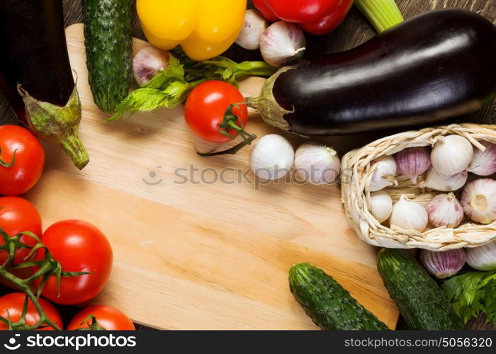 Fresh vegetables. Close up of various vegetables on wooden cutting board