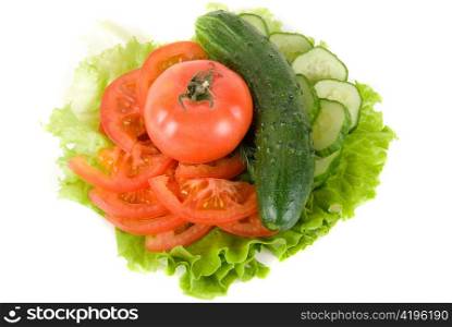 Fresh vegetables: cucumbers salad and tomatoes on plate