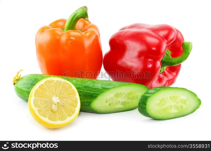 Fresh vegetables fruits (paprika, cucumber and lemon) isolated on a white background. Shot in a studio.