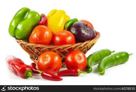 Fresh vegetables in basket isolated on white. Bio Vegetable. Composition with raw vegetables and basket isolated on white