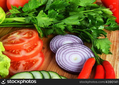 fresh vegetables. Included are tomatoes, cucumber, onions and green leaves