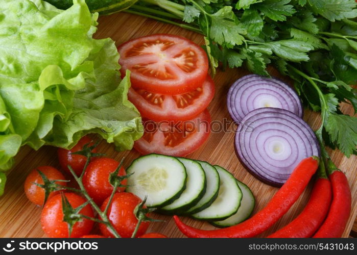 fresh vegetables. Included are tomatoes, cucumber, onions and green leaves