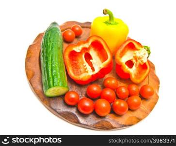 fresh vegetables on a cutting board. close-up on white