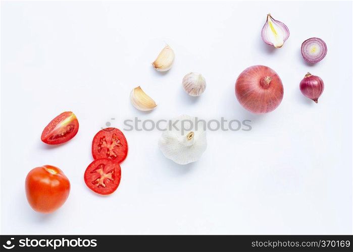 Fresh vegetables on white background.  Tomato, Red onion, garlic,  Healthy eating concept