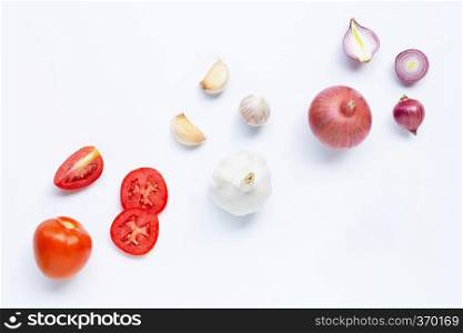 Fresh vegetables on white background.  Tomato, Red onion, garlic,  Healthy eating concept