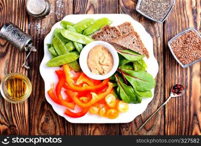 fresh vegetables with sauce from nuts and bread