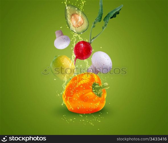 Fresh vegetables with water splashes on blue background.