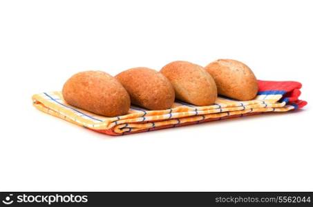 fresh warm rolls over kitchen towel isolated on white background