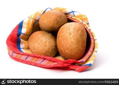 fresh warm rolls over kitchen towel isolated on white background