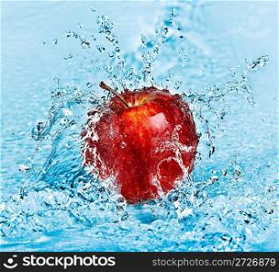 fresh water splash on red apple