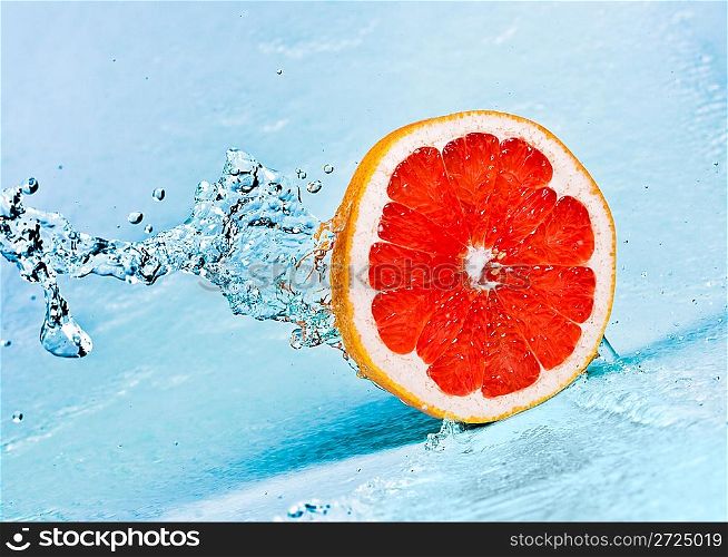 fresh water splash on red grapefruit