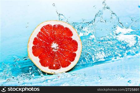 fresh water splash on red grapefruit