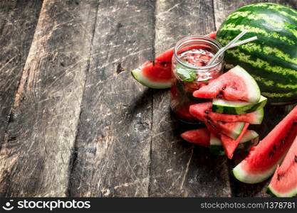 Fresh watermelon juice. On a wooden background.. Fresh watermelon juice.