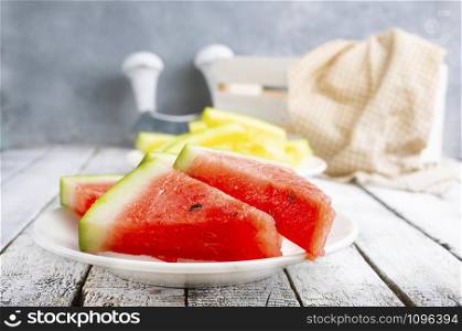 fresh watermelon on plate on a table