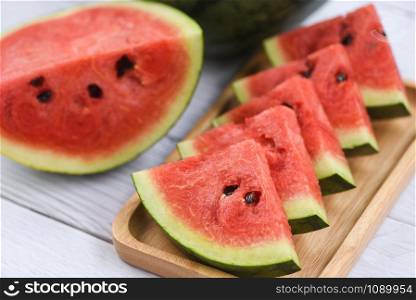 Fresh watermelon slices on wooden background