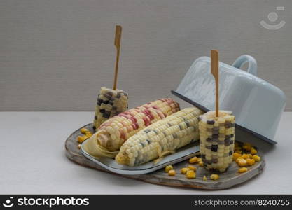 Fresh waxy corn or Sweet glutinous corn and Corn kernels on White background. Tropical whole grain food, Copy space, Selective focus.