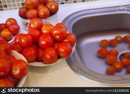 Fresh wet tomatoes on a plate prepared for pasteurization