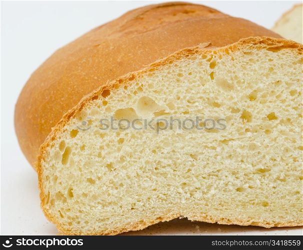 fresh wheat bread - loafs and a round, macro
