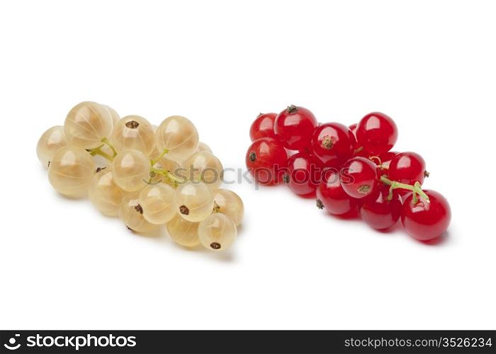 Fresh white currants and red currants on white background
