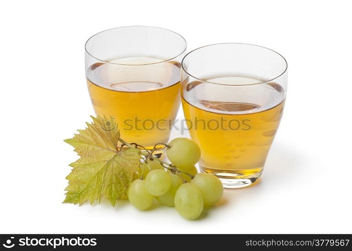 Fresh white grape juice in glasses on white background