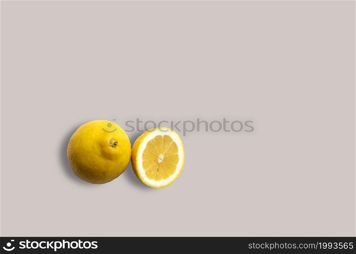 Fresh yellow lemons on a white background for the menu. Geometric background. Flat lay, copy space, top view.